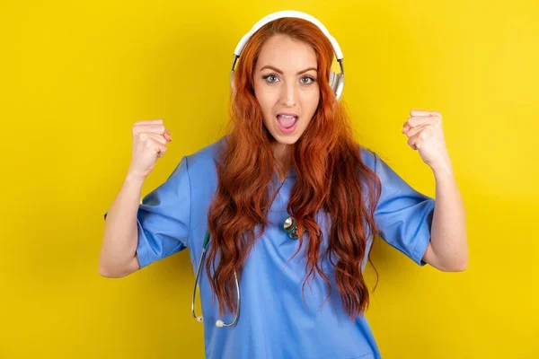 Emotional Young Red Haired Doctor Woman Exclaims Loudly Feels Winner — Stock Photo, Image