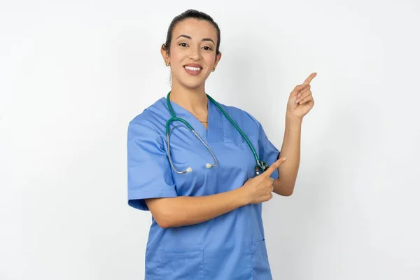 Arab Doctor Woman Wearing Blue Uniform Indicating Finger Empty Space — Stock Photo, Image