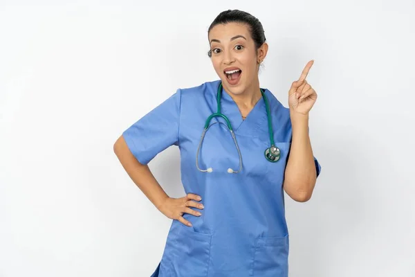Arab Doctor Woman Wearing Blue Uniform Holding Finger Having Idea — Stock Photo, Image