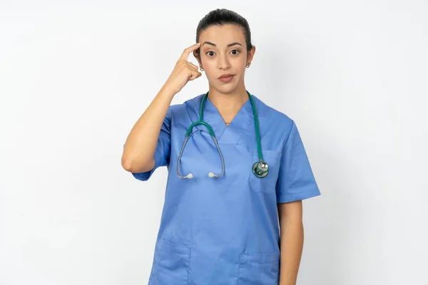 Arab Doctor Woman Wearing Blue Uniform Tries Memorize Something Keeps — Stock Photo, Image