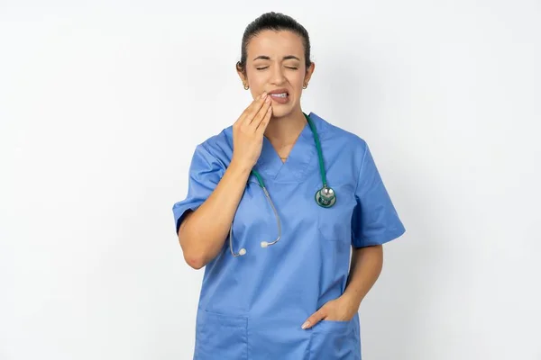 Arab Doctor Woman Wearing Blue Uniform Touching Mouth Hand Painful — Stock Photo, Image