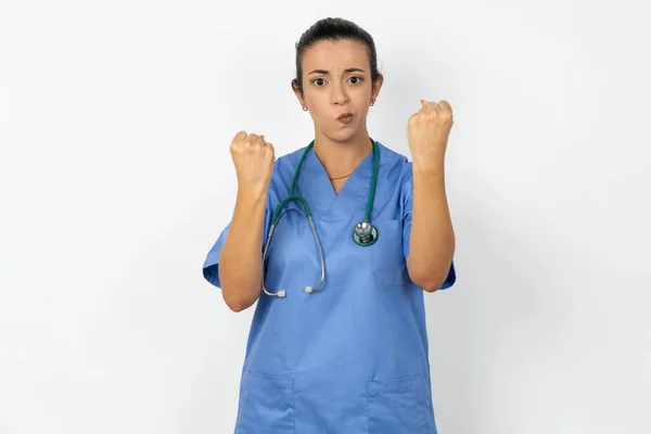 Displeased Annoyed Arab Woman Doctor Uniform Stethoscope Clenches Fists Gestures — ストック写真