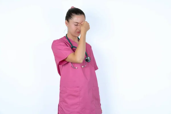 Very Upset Caucasian Woman Doctor Pink Uniform Stethoscope Touching Nose — Stock Photo, Image