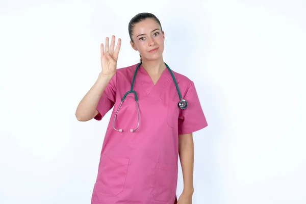 Caucasian Woman Doctor Pink Uniform Stethoscope Showing Pointing Fingers Number — Stock Photo, Image
