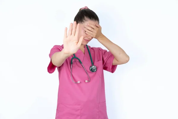 Caucasian Female Doctor Covers Eyes Palm Doing Stop Gesture Tries — Stock Photo, Image