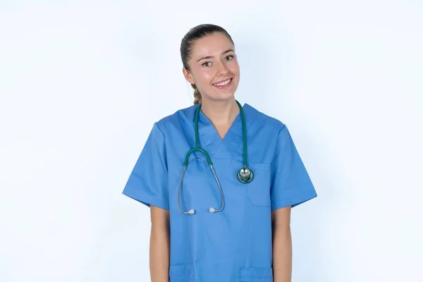 Positive Caucasian Female Doctor Overjoyed Expression Closes Eyes Laughs Shows — Stock Photo, Image