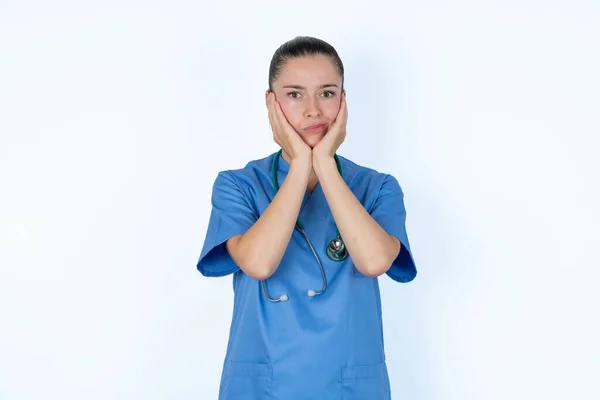Caucasian Female Doctor Surprised Expression Keeps Hands Chin Keeps Lips — Stock Photo, Image