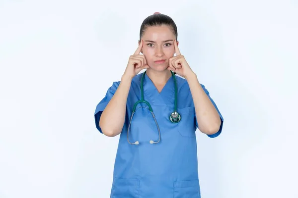Serious Caucasian Female Doctor Keeps Fingers Temples Tries Ease Tension — Stock Photo, Image