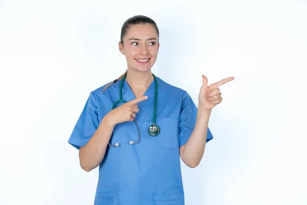 Optimistic Caucasian Woman Doctor Uniform Stethoscope Points Both Hands Looking — Stock Photo, Image