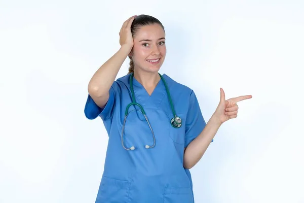 Caucasian Woman Doctor Uniform Stethoscope Pointing Empty Space Holding Hand — Stock Photo, Image