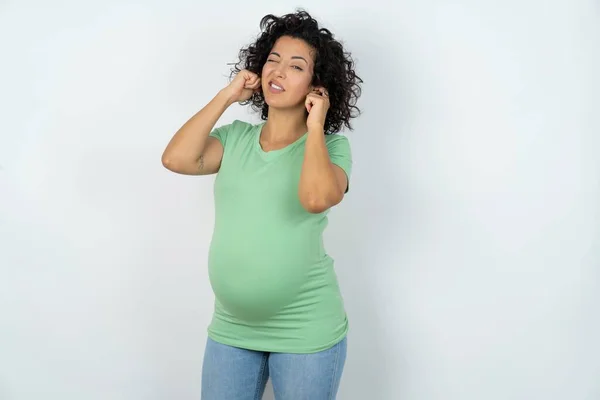 Happy Pregnant Woman Ignores Loud Music Plugs Ears Fingers Asks — Stock Photo, Image