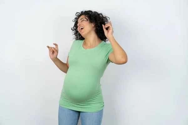 Photo Upbeat Pregnant Woman Has Fun Dances Carefree Wear Being — Stock Photo, Image