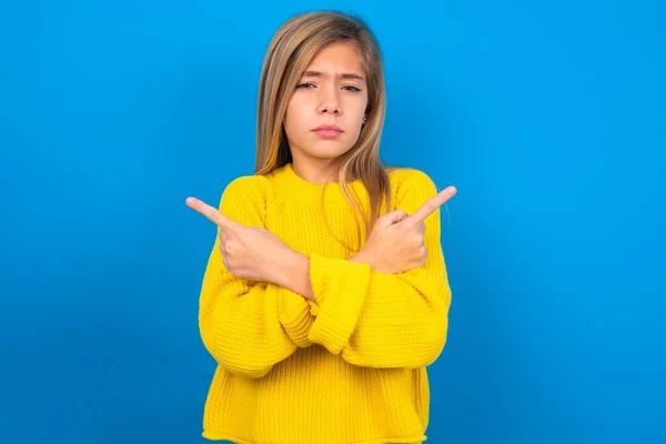Serious Beautiful Blonde Teen Girl Wearing Yellow Sweater Blue Wall — Stock Photo, Image