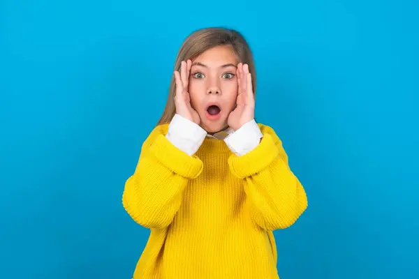 Caucasian Teen Girl Wearing Yellow Sweater Blue Wall Scared Expression — Stock Photo, Image