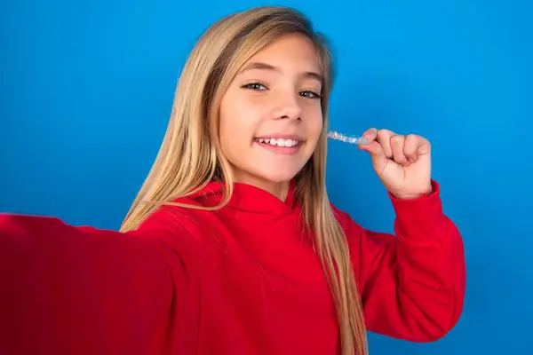 Blonde Teen Girl Wearing Red Sweater Blue Wall Make Selfie — Stock Photo, Image