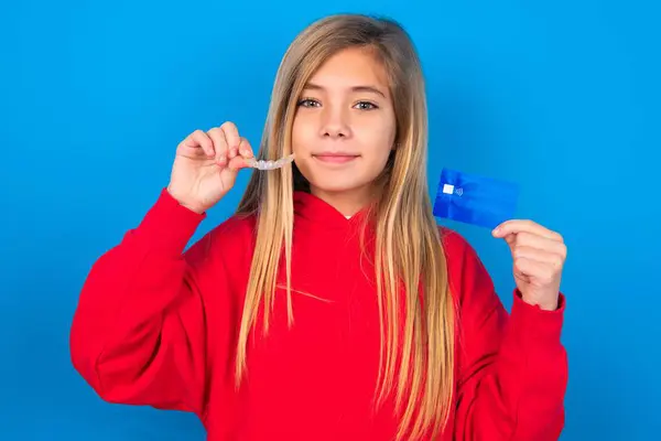 Blonde Teen Girl Wearing Red Sweater Blue Wall Holding Credit — Stock Photo, Image