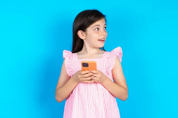 Kid Holds Telephone Beautiful Caucasian Little Girl Posing Blue Studio Stock Picture