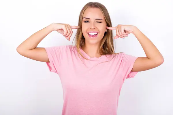 Happy Young Woman Ignores Loud Music Plugs Ears Fingers Asks — Stock Photo, Image