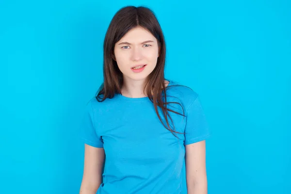 Portrait Dissatisfied Young Caucasian Girl Wearing Blue Shirt Isolated Blue — Stock Photo, Image