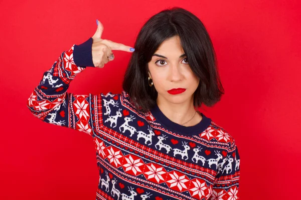 Unhappy Brunette Caucasian Woman Wearing Christmas Sweater Red Background Makes — Stock Photo, Image