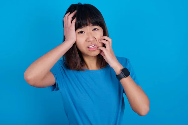 Young Gloomy Young Asian Woman Wearing Shirt Blue Background Hiding — Stock Photo, Image