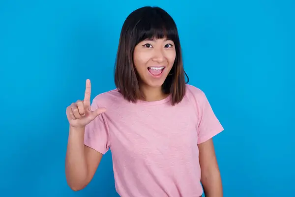 Pleasant Looking Young Asian Woman Wearing Pink Shirt Blue Background — Stock Photo, Image