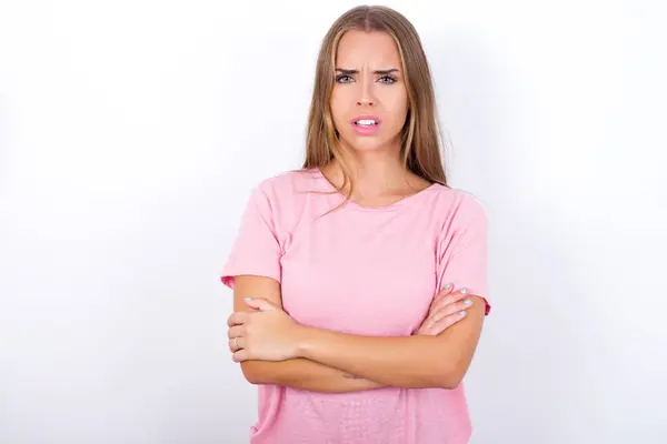 Young Caucasian Girl Wearing Pink Shirt White Background Frowning His — Stock Photo, Image