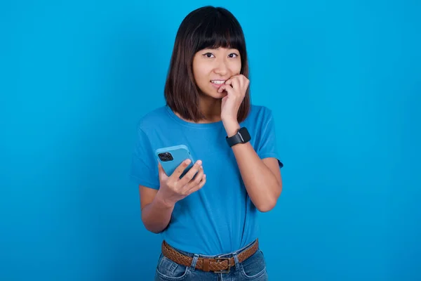 Afraid Funny Young Asian Woman Wearing Blue Shirt Blue Background — Stock Photo, Image