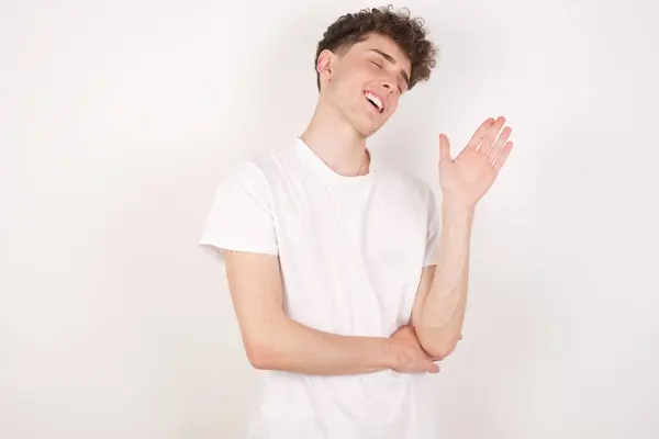 Overjoyed Successful Handsome Young Man White Background Raises Palm Closes — Stock Photo, Image