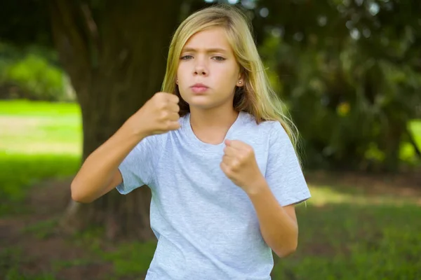 Displeased Annoyed Caucasian Little Girl Wearing White Shirt Standing Outdoors — Stock Photo, Image