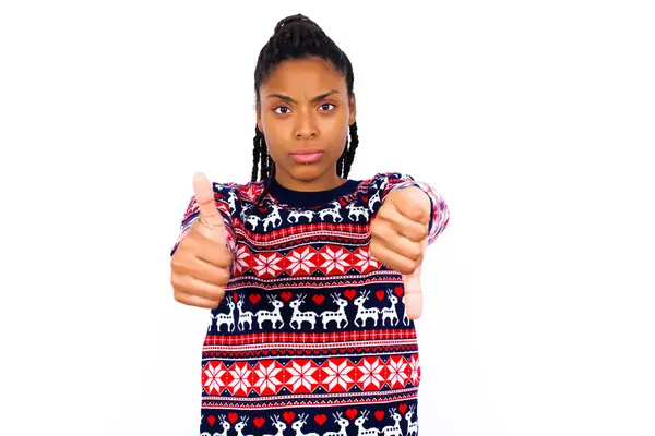 African American Woman Wearing Christmas Sweater White Wall Feeling Unsure — Stock Photo, Image