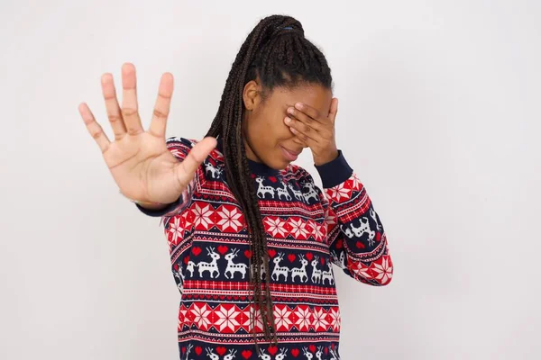 African American Woman Wearing Christmas Sweater White Wall Covers Eyes — Stock Photo, Image