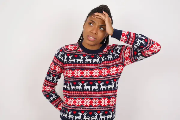 African American Woman Wearing Christmas Sweater White Wall Touching Forehead — Stock Photo, Image