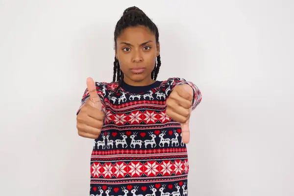 African American Woman Wearing Christmas Sweater White Wall Feeling Unsure — Stock Photo, Image