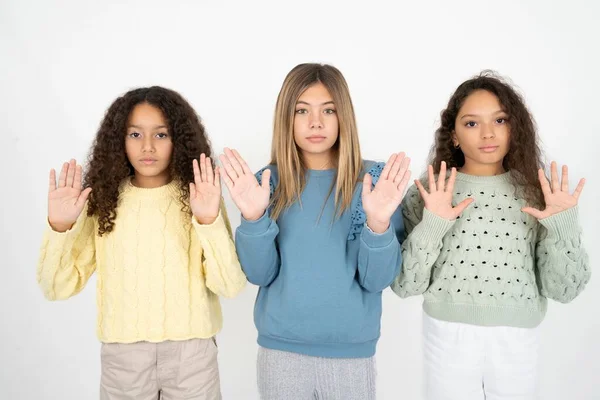 Serious Three Teenager Girls Pulls Palms Camera Makes Stop Gesture — Stock Photo, Image
