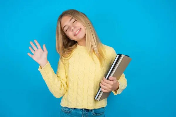 Overjoyed Successful Beautiful Kid Girl Wearing Yellow Sweater Blue Background — Stock Photo, Image