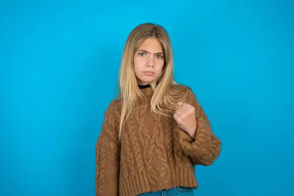 Blonde Kid Girl Wearing Brown Knitted Sweater Blue Background Shows — Stock Photo, Image