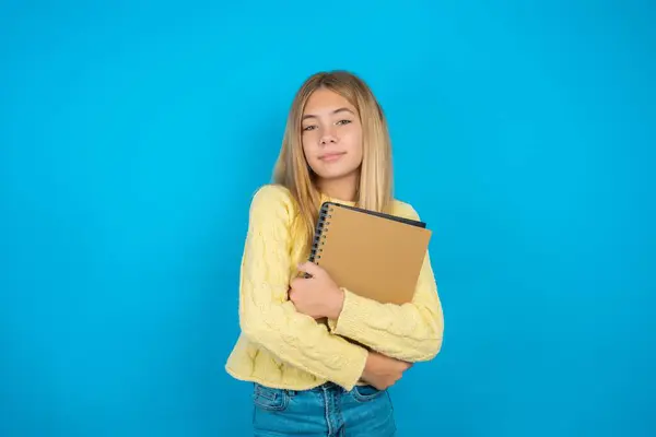Confident Beautiful Kid Girl Wearing Yellow Sweater Blue Background Arms — Stock Photo, Image