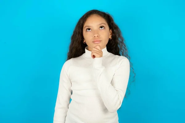 Thoughtful Teenager Girl Wearing White Sweater Holds Chin Looks Away — Stock Photo, Image