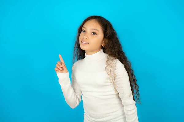 Profile photo of teenager girl wearing white sweater indicate finger empty space offer