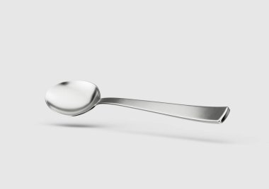 Uzatılmış sapı ve yuvarlak bowling topu gibi beyaz arka planı olan Parlayan Metal bir kaşık.