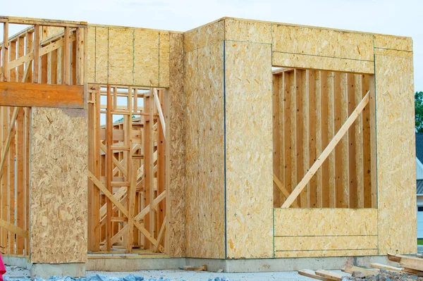 construction of new house wall frame plywood timber plank wooden beam truss