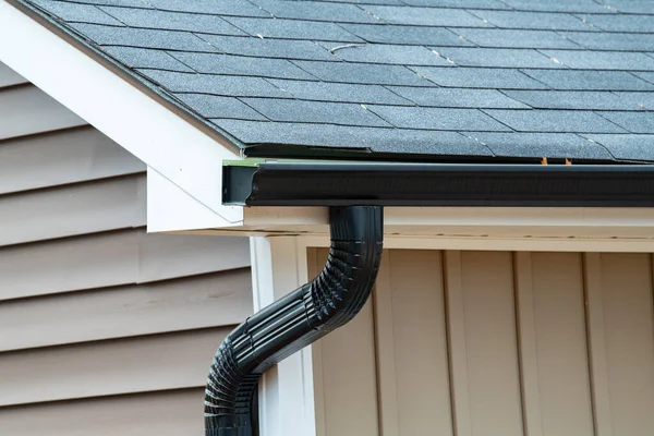 rain gutter of roof with downpipe new metal pipecorner