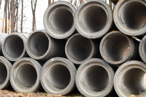 large concrete sewer pipes drain gray stack heavy