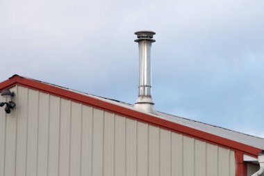 silver iron chimney pipe of the stove in the house roof smoke roofingnew silver