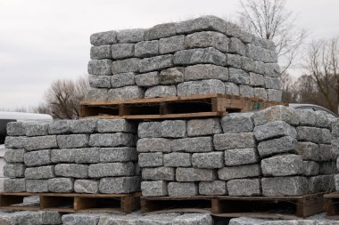 pallets with natural facing stone and cobblestones tezture gray stacked