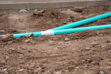 construction site with new water pipes laying tube supply ground plastic