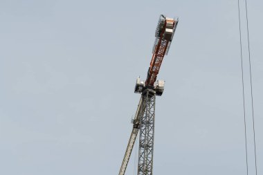 building crane and building under construction steel tower modern frame