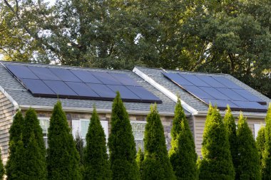 solar panels producing clean energy on a roof of a residential house clean power clipart