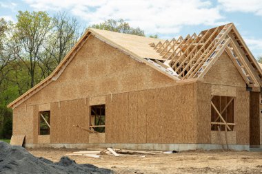 unfinished new plywood house building lumber wooden roofing site clipart